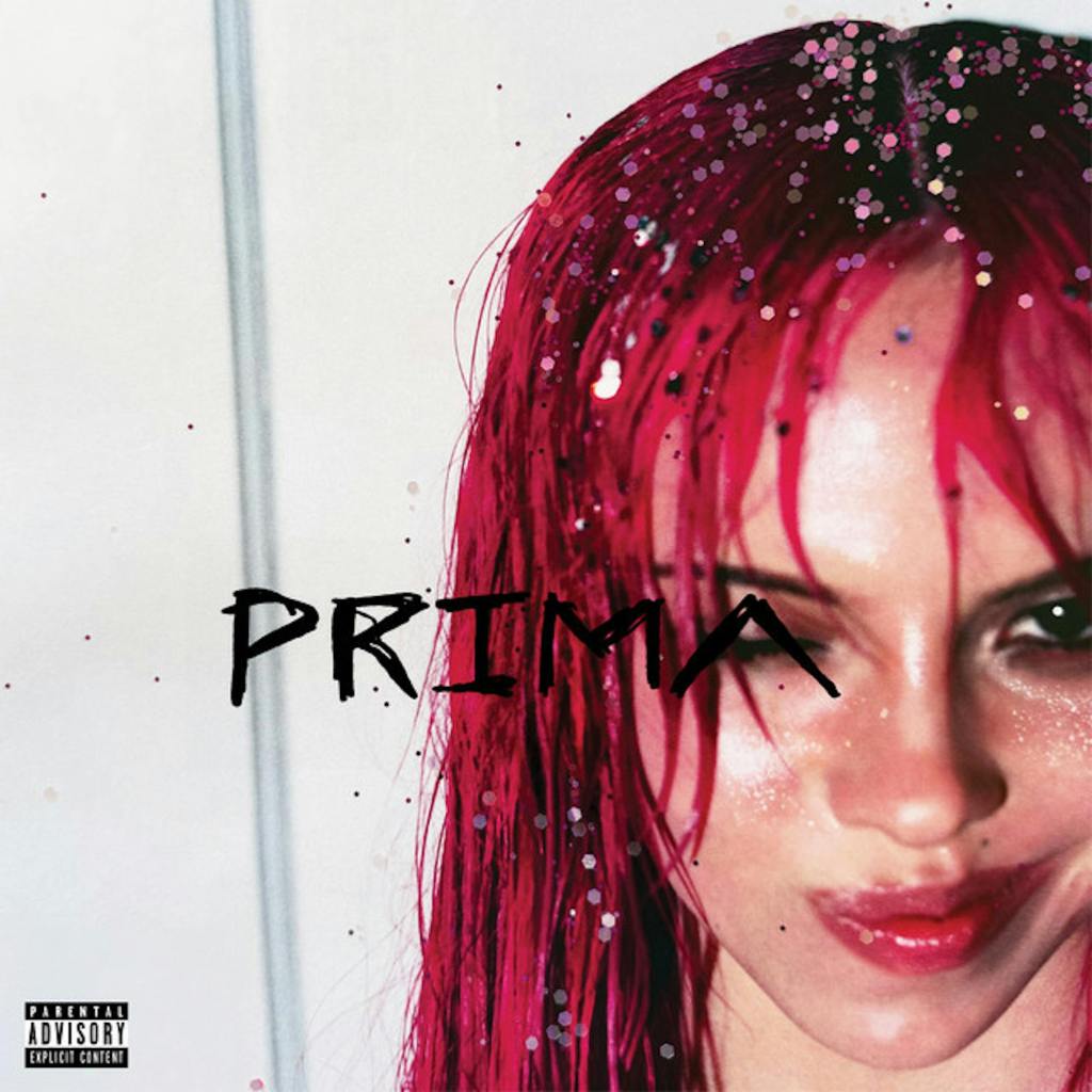 Close-up portrait of a person with wet, vibrant pink hair, staring confidently at the camera with a playful expression, featuring the word 'PRIMA' in bold font across the center.